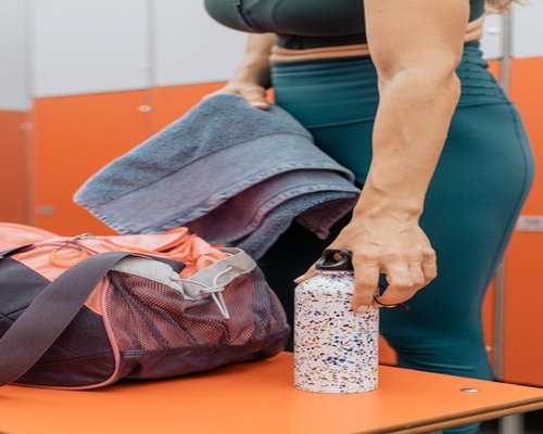 Gym bag with a clean towel and fresh water